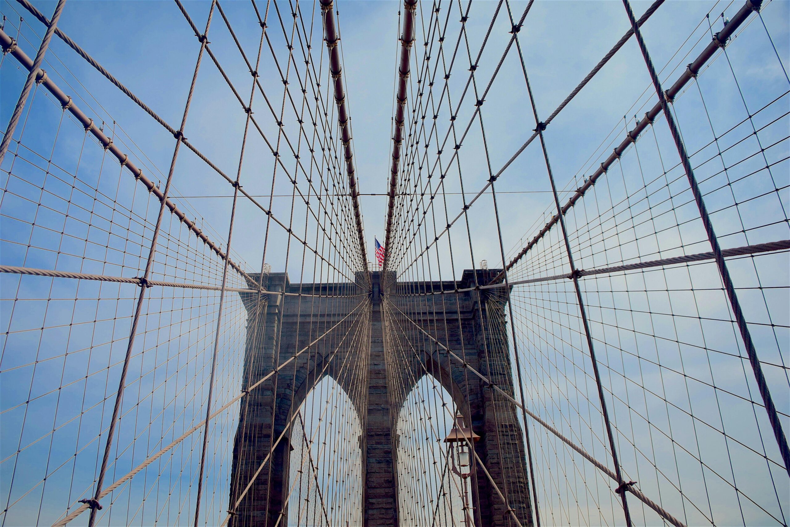 Low angle view of the Brooklyn Bridge cables and structure in New York City.